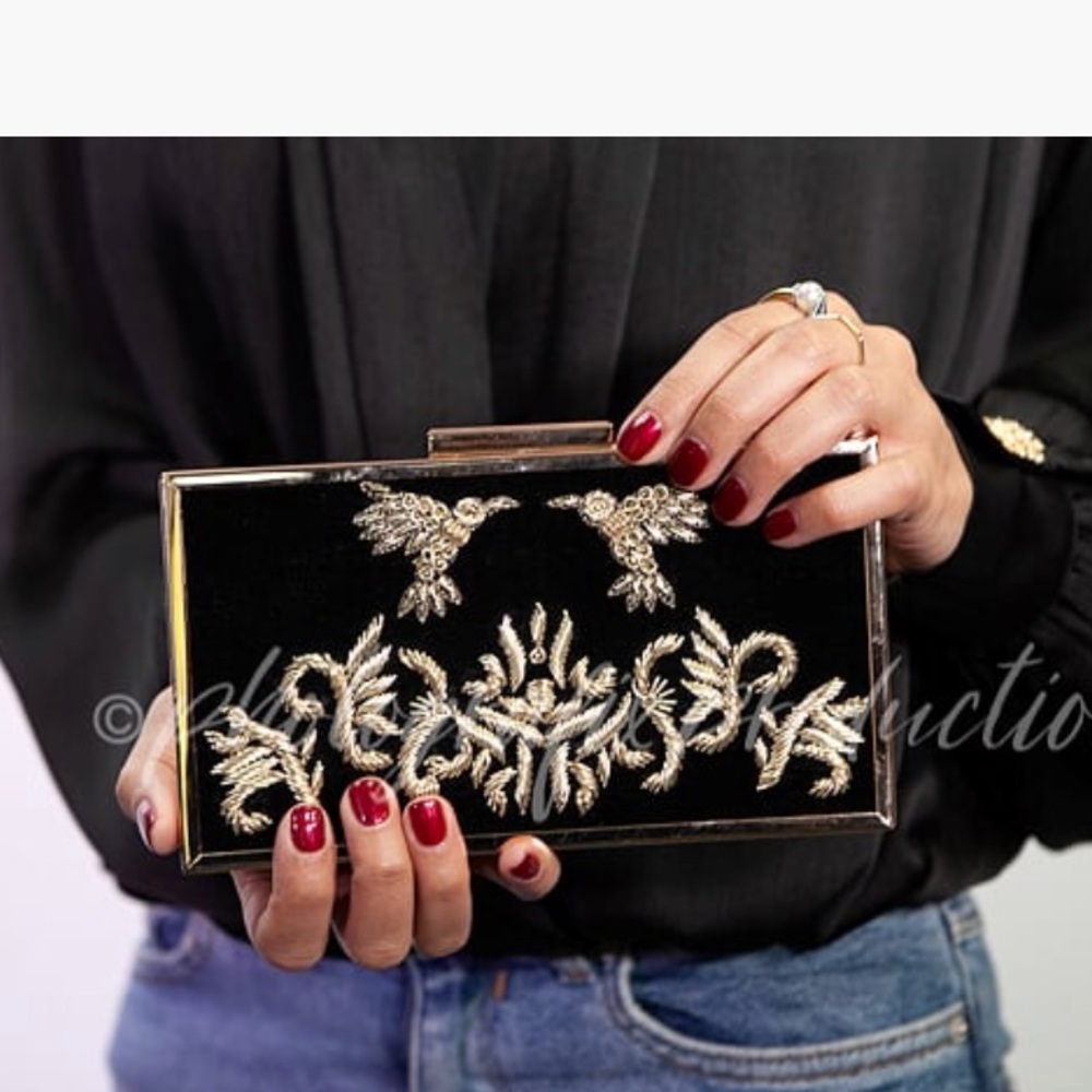 hand embroidered clutch with long gold chain